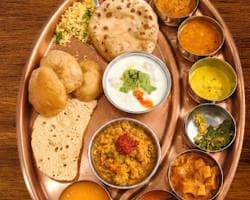 Special homemade thali with sabzi, dal, rice and sweet